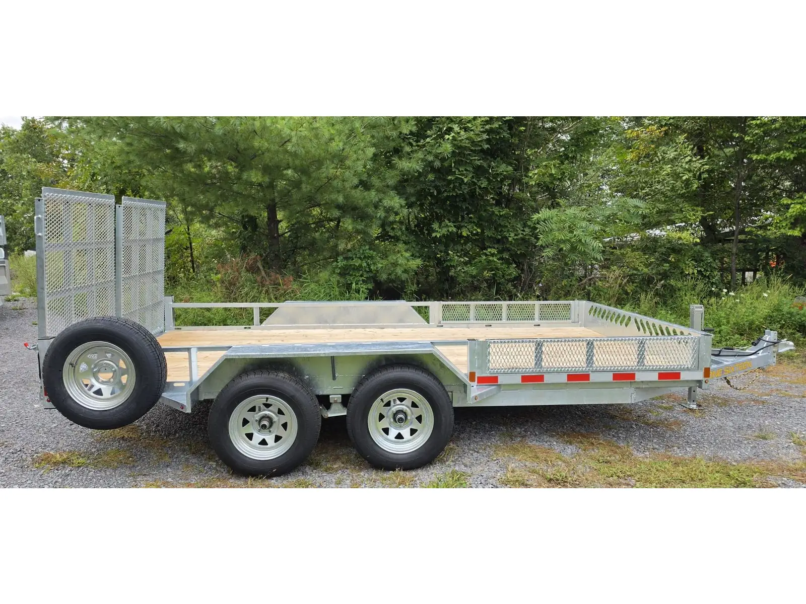 Side profile of the galvanized tandem axle open rail utility trailer